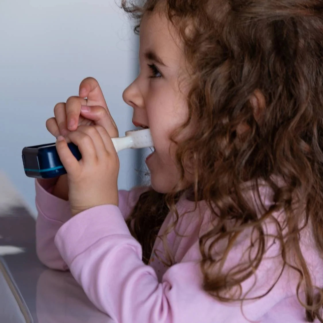 Child with a toothbrush